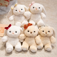 Peluche Lapin aux Oreilles Tombantes Moelleuse, Adorable Lapin Assis Blanc Beige avec Nœud en Velours Fleuri, Idéal pour Cadeau d'Anniversaire ou Décoration pour Enfants