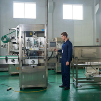 Machine d'étiquetage automatique à manchon rétractable pour bouteilles, canettes, barils, emballages en verre et en plastique