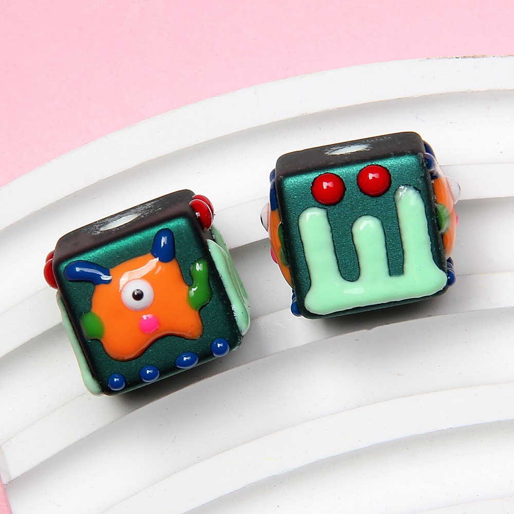 Pearlescent dark green beads + orange monster
