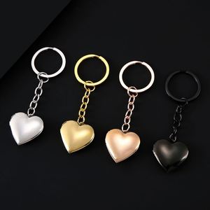 Espejo de Moda con Acabado Metálico Liso, Puede Contener Fotos, Caja de Fotos en Forma de Corazón Color Durazno, Llavero de Acero Inoxidable - Product Image 1