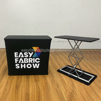 Table de comptoir portable automatique OEM avec plateau en tissu et structure en acier aluminium – Tables pop-up pour expositions et stands