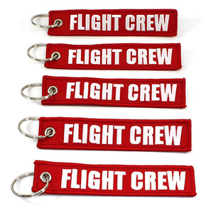 Venta al por mayor barato personalizado marca mover vuelo coche logotipo tela clave etiqueta bordado llavero - Product Image 6