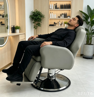 Fauteuil de barbier de luxe personnalisé en cuir gris avec pompe hydraulique inclinable synthétique pour salon de coiffure