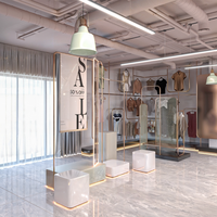 Présentoir brutaliste pour magasin de vêtements au détail de luxe Mobilier de boutique personnalisé Surface en acier inoxydable OEM/ODM Vêtements en bois