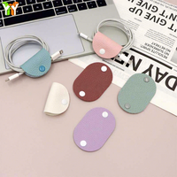 Mini enrouleur de câbles en cuir PU de forme ovale, organisateur de cordons couleur macaron, attache-câbles réutilisable pour la maison et les voyages quotidiens (vente en gros)
