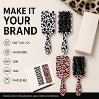 Brosse à cheveux en gros à imprimé léopard, brosse démêlante à coussin d'air pour massage du cuir chevelu pour femmes, logo personnalisé OEM ODM pour salon de coiffure