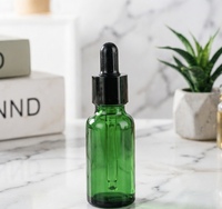 Flacon rond en verre vert pour huile essentielle et crème pour les yeux, flacon cosmétique anti-lumière pour sérum et parfum avec compte-gouttes