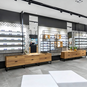 Mobilier de présentation sur mesure pour magasins d'optique,avec finitions dorées, et comptoirs d'accueil pour magasins d'optiqe - Product Image 2