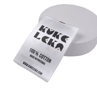 Étiquette de lavage recyclable rouleau vierge bord tissé en satin gros rouleau d'étiquettes de composition en satin blanc pour vêtement