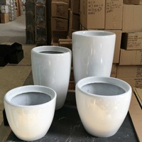 Vente directe d'usine Pots de plantes ronds Pots de fleurs de grande taille pour l'extérieur Style moderne Utilisation pour les hôtels et les villas Fleurs/plantes