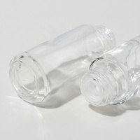 Botol Serum Kaca Bulat Bening 20ml 30ml dengan Dasar Tebal dan Pipet Tetes untuk Minyak Esensial dengan Logo Kustom