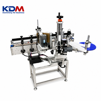 Machine d'étiquetage de bouteilles rondes en ligne à grande vitesse KDM-AL150C pour les lignes de boissons, de vin et d'eau