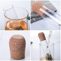 Vente en gros de petits infuseurs à thé en verre borosilicaté Passoire à thé en métal bon marché avec couvercle en liège pour voyage Ustensiles de Noël
