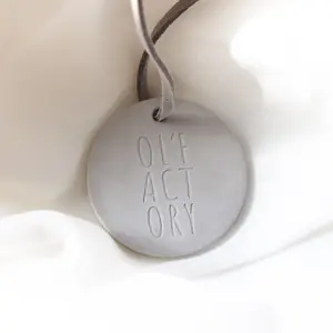 OEM Customized Gray Round Home Aroma Oil Diffuser Hanging Car Decoration Scented Perfumable Ceramic Clay Stone