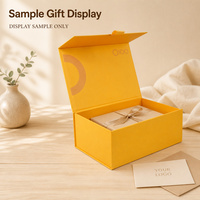 Caja de regalo plegable amarilla con diseño impreso y asa superior para regalos minoristas, embalaje de marca, exhibición premium y suministro.