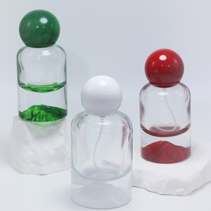 Bouteilles de parfum en verre cylindriques OEM/ODM de 30 ml, 50 ml, 100 ml avec fond doré, argenté, bleu, rouge, vert pour cadeaux et parfums - Product Image 4