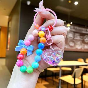 Porte-clés personnalisé avec perles et paillettes liquides, cœur et nœud arc-en-ciel, sangle de téléphone Kawaii pour filles, cadeau d'anniversaire pour adolescentes, vente en gros - Product Image 3