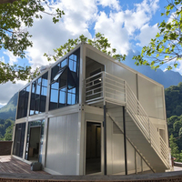 Maison conteneur préfabriquée détachable 20ft 40ft, design moderne de luxe, mur-rideau en verre noir, villa/appartement en acier respirant