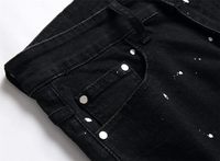 Jean slim déchiré pour homme avec patchs, coupe fuselée, en denim extensible et élastique