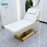 Table de massage de luxe à base dorée, lit pour les cils, salon de beauté, mobilier d'esthéticienne, lit facial incurvé, lit électrique pour les cils, lit cosmétique