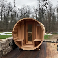 Sauna extérieur moderne en forme de baril électrique avec des tuiles en cèdre rouge massif pour utilisation en villa