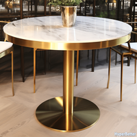 Depuis 2005, table basse ronde en marbre naturel sur mesure avec cadre doré et pieds en acier inoxydable doré.