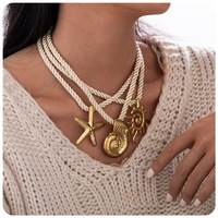 Collier tendance d'été en acier inoxydable plaqué or 18 carats PVD avec pendentifs coquillage, étoile de mer et soleil, chaîne corde et perles