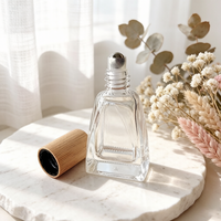 Flacons roll-on en verre transparent de 10 ml de forme spéciale haut de gamme, flacons de luxe pour huiles parfumées, bouchons en bambou, bille roulante en acier inoxydable