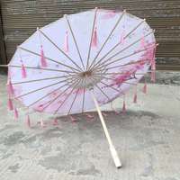 Parapluie en papier fait main, résistant à la pluie et au vent, avec poignée et pompons, motif fleur de prunier, peinture à l'huile chinoise, idéal pour la danse