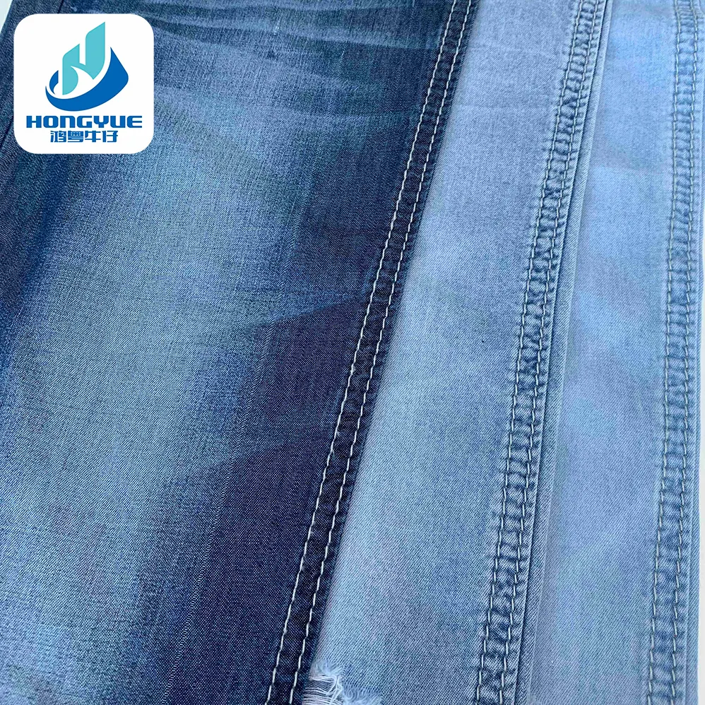 قماش جينز من Lyocell طري وخفيف الوزن لا يلمس اليدين كما أنه مطاطي 2/1 قماش جينز قميص من قماش الدنيم بسعر المصنع