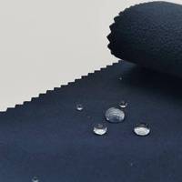 A prueba de viento cálido transpirable 4 vías estiramiento impermeable poliéster Softshell tela para traje de esquí chaqueta