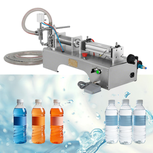 Fabrieksmachine voor horizontale vulling met dubbele kop, 0,4-0,6 MPa luchtdruk, voor bier, puur water, vloeibare zeep, sap, flesjes, shampoo en olie. - Product Image 1