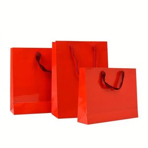 ถุงกระดาษคราฟท์สีขาวสุดหรูถุงของขวัญสำหรับเสื้อผ้าเทียนและบรรจุภัณฑ์งานฝีมือริบบิ้นจับบนกระดาษแข็งสีขาวโลโก้ที่กำหนดเองยินดีต้อนรับ - Product Image 4