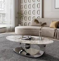 Table basse ovale exquise pour la maison, base en forme de boule dorée, design unique, table à thé, table d'appoint pour la maison, l'hôtel, la villa, le salon