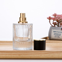 Flacon de parfum en verre transparent OEM 30ml 50ml, cylindre vide, luxe, noir mat, couvercle magnétique, boîte cadeau, vaporisateur à pompe, emballage