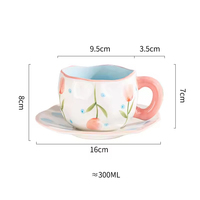 Les tasses en céramique à motif de fleurs et d'assiettes mignonnes peintes à la main de 250ml comprennent une tasse et une soucoupe pour la maison et le bureau