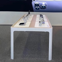 Mesa de exhibición de teléfono móvil ecológica moderna, tienda de precio de fábrica, muebles para tiendas de cadena minorista de teléfono móvil y tiendas de marca