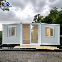 Casa Modular Expandible de Acero con Estructura en I, Acabado Gris Claro con Detalles Blancos, Puerta Corredera, Prefabricada, Reubicable, Almacén Listo para Usar, Hogar Moderno