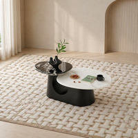 Juego de Mesa de Centro para Sala de Estar Global Export Avant Garde, Diseño Asimétrico de Pétalos, en Blanco y Negro, Dos Niveles, Panel de Vidrio y Piedra Tecnológica