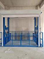 Plateforme de levage hydraulique robuste Risenmega 1t avec rail de guidage vertical pour manutention de matériaux 12m en acier au manganèse Q345B CE ISO9001