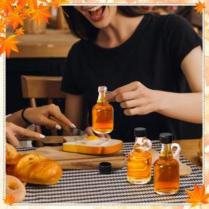 Tarros de jarabe de vidrio transparente de 3,4 oz con mango de bucle Tapas negras reutilizables de <span class=keywords><strong>100ml</strong></span> para salsa para jarabe de arce y Tequila - Product Image 5