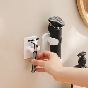 Nuevo tipo de soporte para maquinilla de afeitar manual y eléctrica sin perforaciones, soporte colgante montado en la pared simple blanco para inodoro de baño