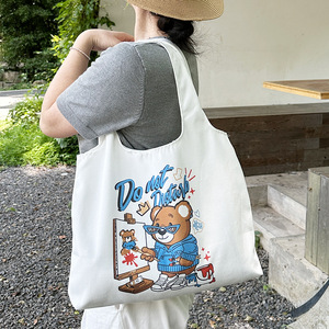 กระเป๋าผ้าแคนวาสลายการ์ตูนสำหรับผู้หญิง ใช้ได้ทุกโอกาส เหมาะสำหรับนักเรียน พกพาสะดวก ใช้ใส่อาหารกลางวัน ปิดปากกระเป๋าแบบเปิด ฤดูร้อน 2023 - Product Image 2