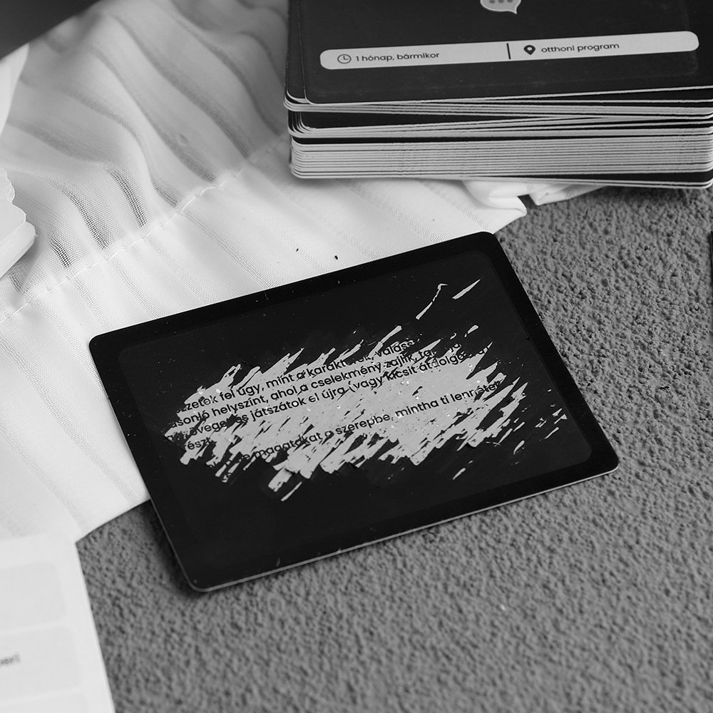 Card with black scratch coating