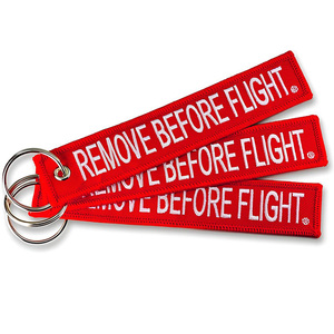Venta al por mayor barato personalizado marca mover vuelo coche logotipo tela clave etiqueta bordado llavero - Product Image 1
