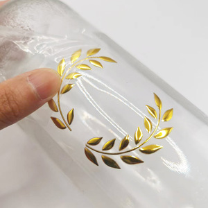Adesivo personalizzato in PVC lucido con Logo lamina d'oro UV Transfer timbro a caldo tecnica per il profumo lucido imballaggio materiali ausiliari - Product Image 1