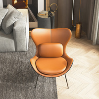 Fauteuil lounge en cuir tanné bicolore avec cadre en métal noir mat, dossier haut, coussin lombaire, ottoman en PU, pour extérieur, vente en gros, Sessel