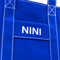 Sac fourre-tout en toile bleue avec logo personnalisé, sac à bandoulière robuste pour bateau et transport, surpiqûres contrastées blanches, sac à main réutilisable pour le voyage et le shopping