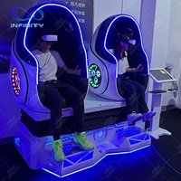 Forme d'oeuf de réalité virtuelle de jeu de cinéma de simulateur de 9D Vr deux sièges chaise d'oeuf de 9D Vr pour le parc à thème de parc d'attractions de Vr de deux joueurs