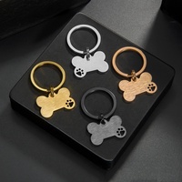 Porte-clés tendance en acier inoxydable, forme d'os avec empreinte de patte mignonne, gravure personnalisée, anti-perte, finition brillante, avec anneau fendu